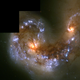 Illustration for article titled The Cosmic Wonder of Colliding Galaxies